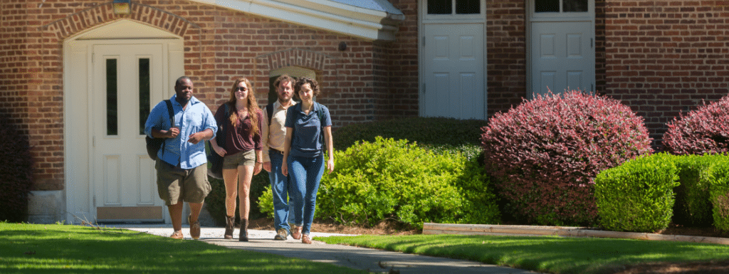 A group of students walking towards the camera. 