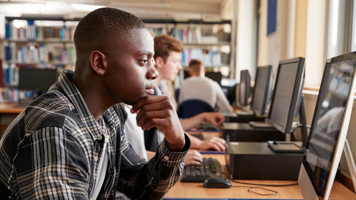 Students walking on computers