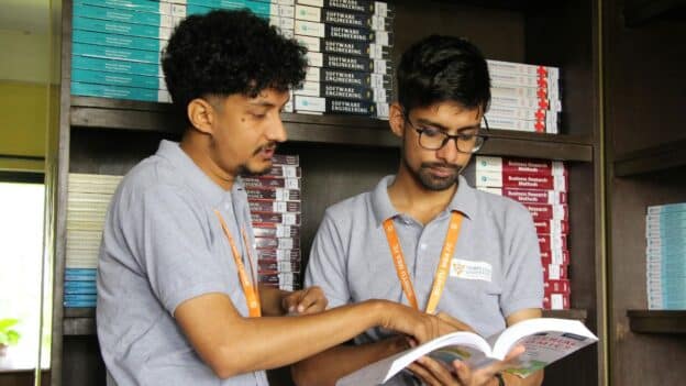 Two people looking an an open book