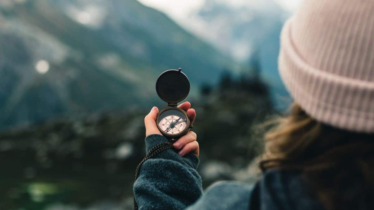 A person holding a compass