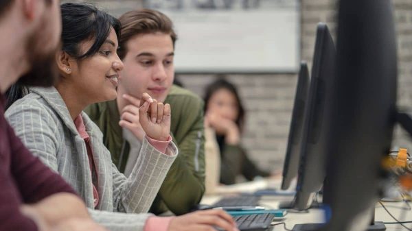 Resource feature image, three people looking at computers
