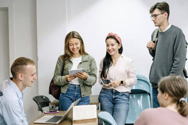 People gathered around a table talking