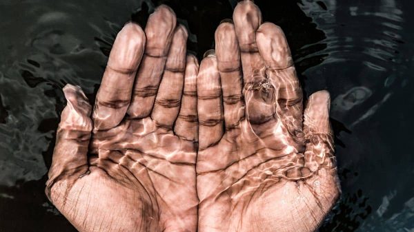 Resource feature image, hands under clear water